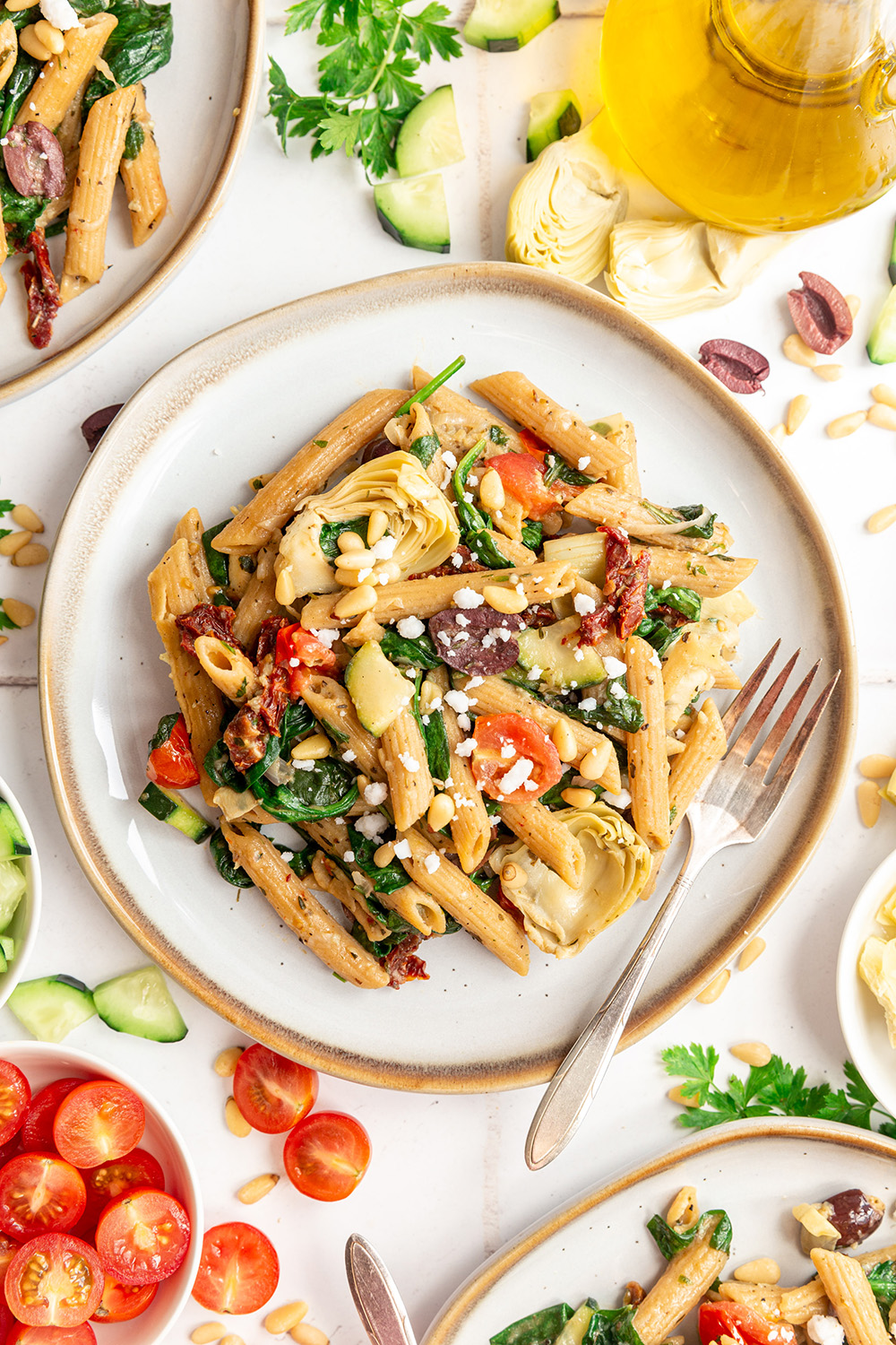 Gluten-Free Greek Pasta full of spinach, artichokes, tomatoes, and olives